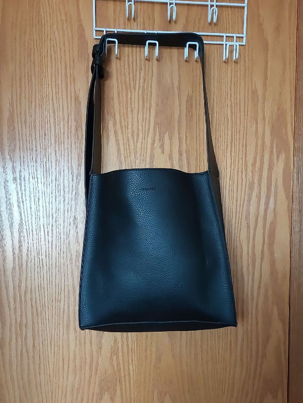 Remi/Reid black pebble leather bag